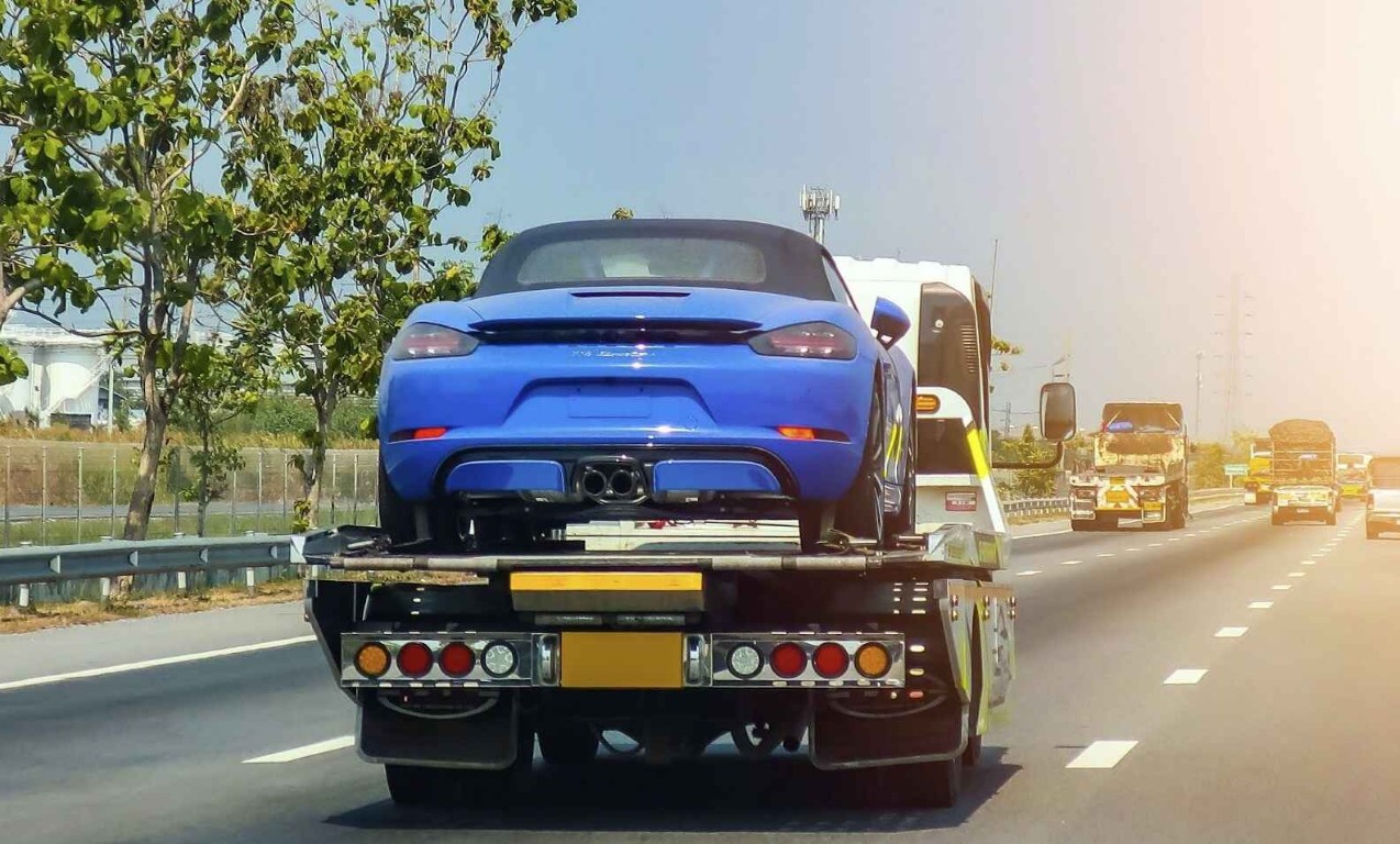 Long-distance towing of a sports car on highway