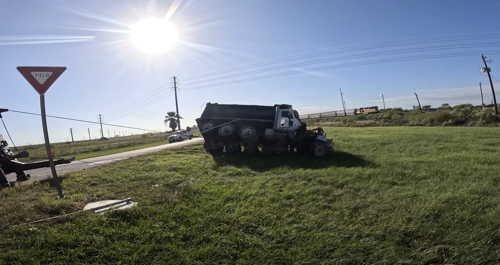 Professional accident recovery and vehicle towing services in Elmhurst IL Professional towing truck safely recovering accident vehicle from roadside
